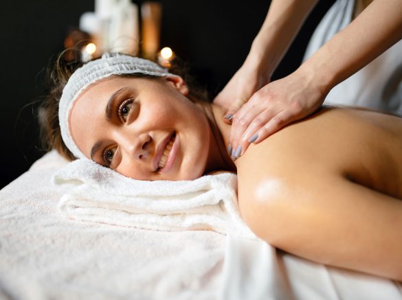 beautiful-young-and-cute-woman-enjoying-massage-UZ97GDC.jpg